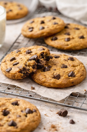 Close up of melted chocolate pulling from a warm cookie